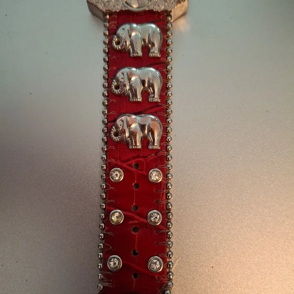 Geneva 92643 Womens Buckle Watch. Red Band, Silvertone,Elephant & Gem Accents.
